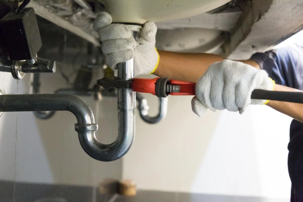 Hydro Jetting in Katy, TX 11 Plumbers in Katy, TX - 65a9454f7b522c7b3d24056d plumber fixing white sink pipe with adjustable wrench picture id1150199946